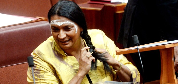 Nova Peris braids her hair before her maiden speech in the Senate. Photo: AAP.