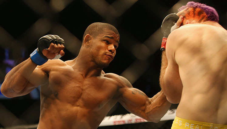 Alex Garcia (left) lands combinations on Australia's Ben Wall.