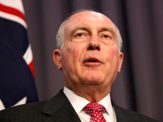 Warren Truss addresses the media in Canberra