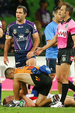 Alex McKinnon is treated after landing on his head. Picture: Getty