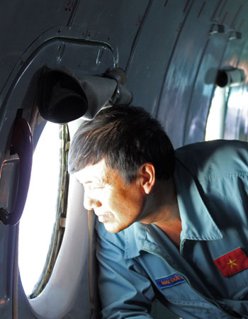 A Vietnamese serviceman scans the South China Sea.