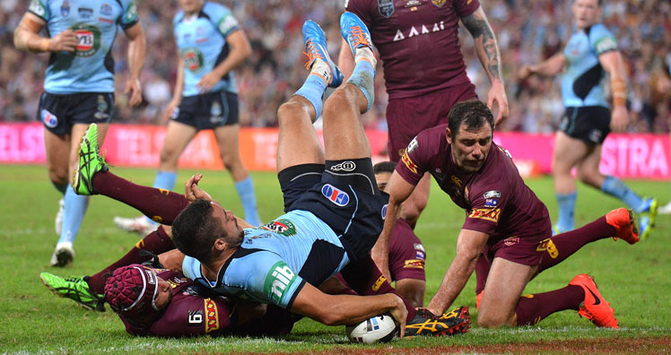 Jarryd Hayne somehow manages to get the ball over the try-line. Photo: Getty