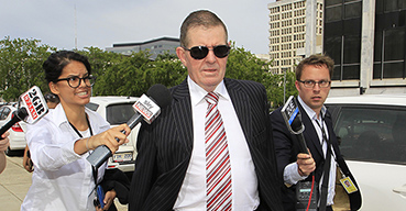 Peter Slipper enters the ACT Magistrates court in Canberra.