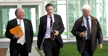 Independent MP's Tony Windsor, Rob Oakeshott and Bob Katter at Parliament House, Canberra, in 2010.