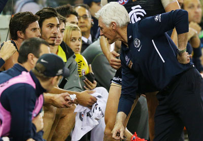 Mick Malthouse has a friendly chat with his skipper Marc Murphy. Photo: Getty