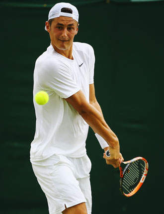 Bernard Tomic lines up a backhand during his victory. Photo: Getty