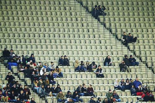 It's freezing cold, wet and the game is live on TV. Why would you bother? Photo: Getty