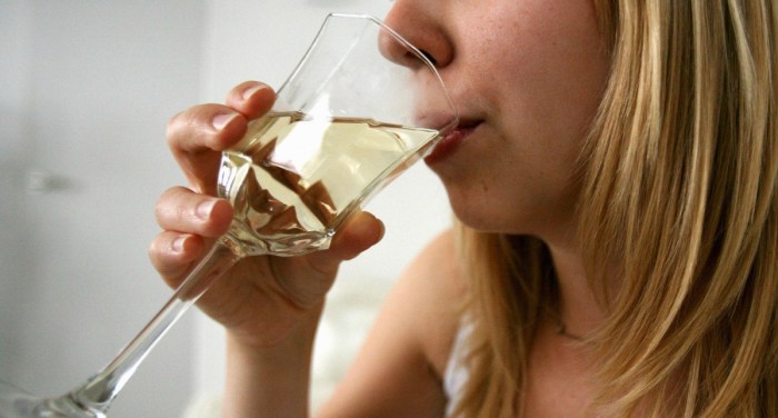 Woman drinking white wine. Source: AAP.