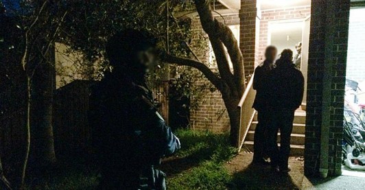 Police execute a search warrant in Sydney.