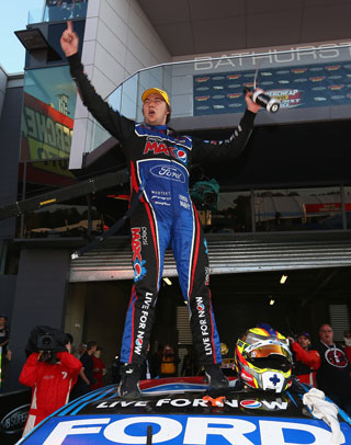 Chaz Mostert on top of the world - and his Ford. Photo: Getty