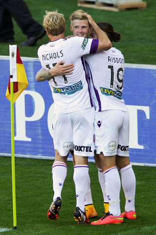 Irish import Andy Keogh is mobbed after scoring for Perth Glory. Photo: Getty