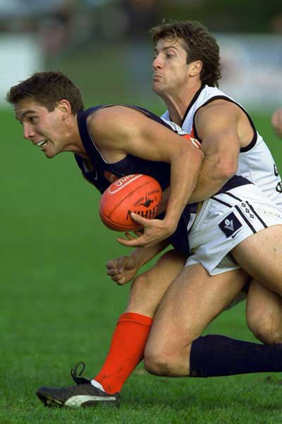Beveridge lays a tackle while playing for Frankston in the VFL. Photo: Getty