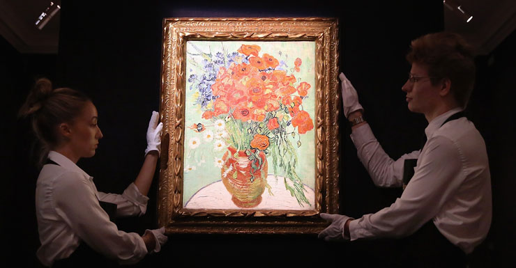 Gallery employees display art work