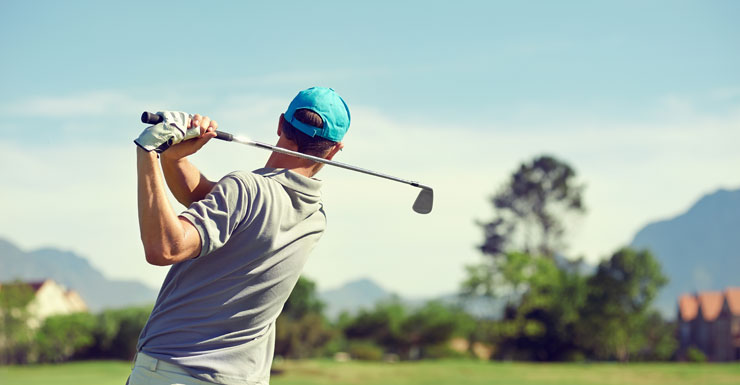 Man takes swing at golf club
