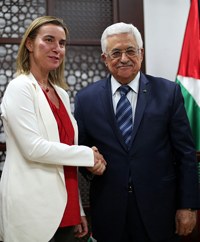 Palestinian president Mahmoud Abbas (R) poses for a picture with European Union's new foreign affairs chief Federica Mogherini .