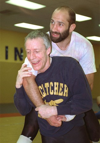 John E. du Pont and Dave Schulz horse around at the Foxcatcher centre. Photo: AAP