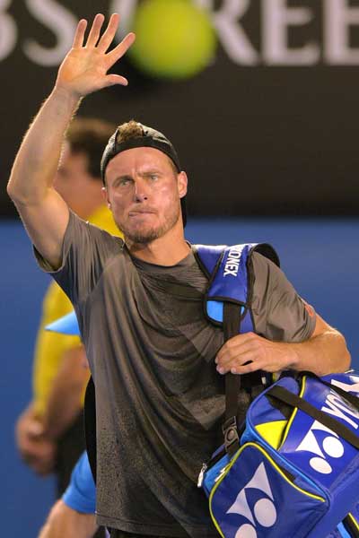 Lleyton Hewitt gives the fans a quick wave before departing Rod Laver Arena. Photo: Getty