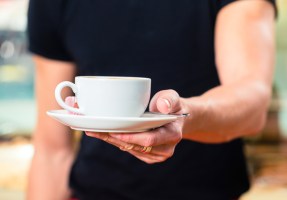 Waiter with coffee cafe