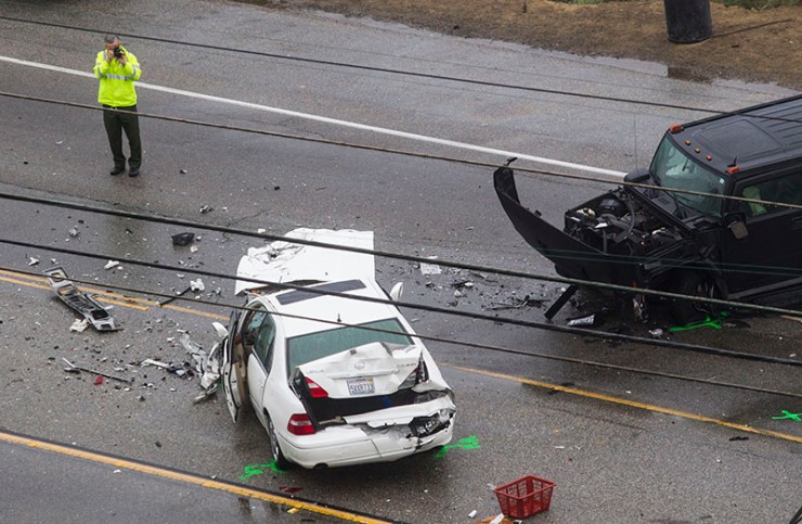 A sheriff at the scene of the fatal crash in Malibu. Photo: AAP