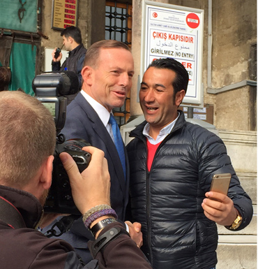 Tony Abbott poses with a visitor who wanted a selfie at the Blue Mosque in Istanbul, Turkey.