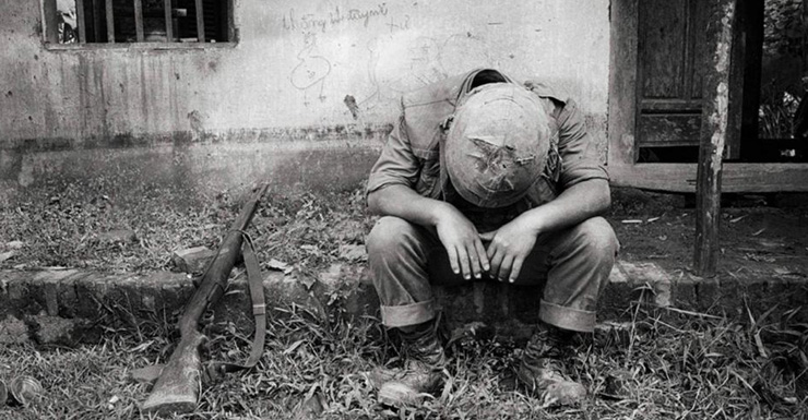 "I ended up calling it 'The Universal Soldier', it's an old weapon, it's a western helmet... it's actually after a very heavy fire fight with the Korean marines", Tim Page said of this photo.