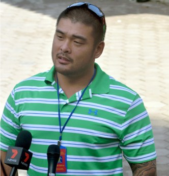 Michael Chan, brother of Andrew, faces the media.