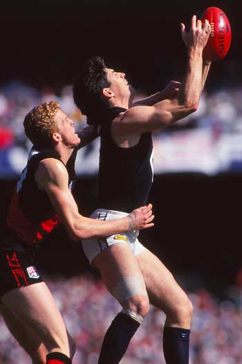 Dustin Fletcher on Stephen Kernahan in the 1993 Grand Final. Photo: Getty