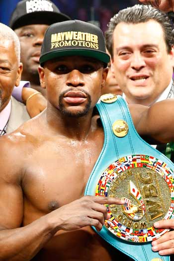 Mayweather with his WBC welterweight title belt. Photo: Getty