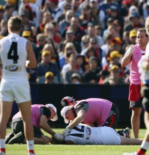 Nick Riewoldt lies unconscious on the field after a collision. Photo: AAP