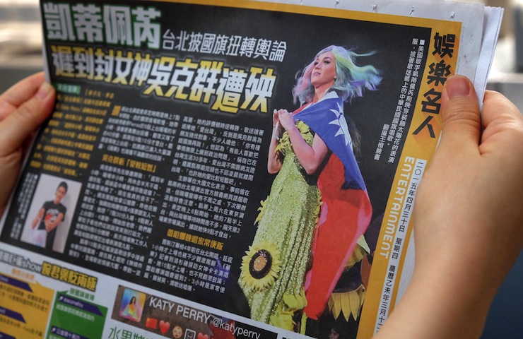 A newspaper in Taipei features an article about Perry's controversial costume. Photo: AAP