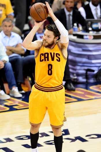 Matthew Dellavedova gets a shot off. Photo: Getty