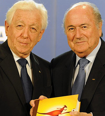 Frank Lowry (l) is under pressure as the FIFA scandal spreads. Pictured with resigned president Sepp Blatter.
