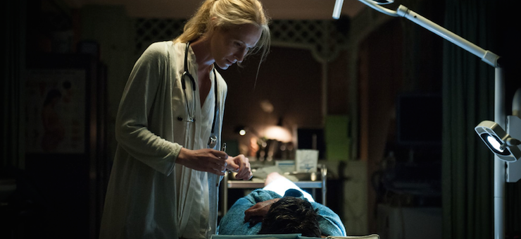 Doctor Elishia McKellar (Genevieve O'Reilly) inspects one of the resurrected.