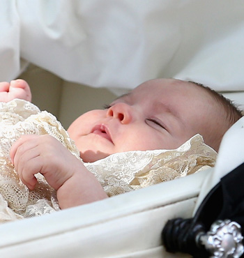 Princess Charlotte of Cambridge is pushed in her silver cross pram.