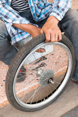 With the right tools, replacing a tyre is fairly easy. Photo: Shutterstock