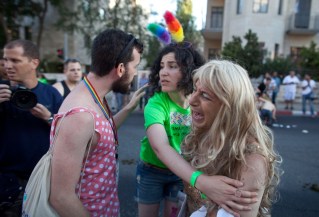 Tensions are high in Jerusalem between religious groups and gay advocates. Here they mourn the stabbings. Photo: Getty