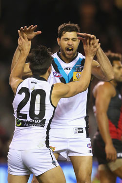 Paddy Ryder (R) celebrates one of his four goals with Chad Wingard. Photo: Getty