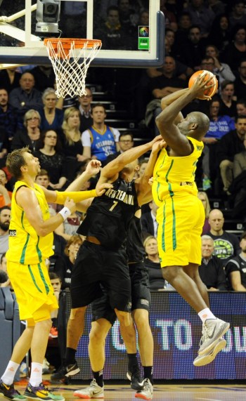 Australia's Nathan Jawai shoots against New Zealand.