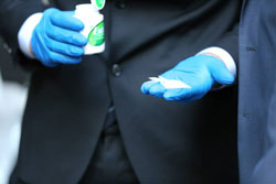An officer displays some of the illicit drugs seized during the operation. Photo: Facebook