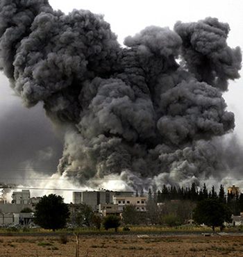 Smoke rises after an air strike on the Syrian town of Kobane.