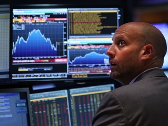 NEW YORK, NY - AUGUST 24: A trader works on the floor of the New York Stock Exchange (NYSE) on August 24, 2015 in New York City. As the global economy continues to react from events in China, markets dropped significantly around the world on Monday. The Dow Jones industrial average briefly dropped over 1000 points in morning trading and closed down 588 points. (Photo by Spencer Platt/Getty Images)
