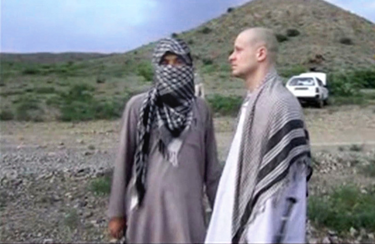 In this image taken from video obtained from Voice Of Jihad Website, Sgt. Bergdahl, right, stands with a Taliban fighter in eastern Afghanistan. Photo: AAP
