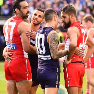 Fremantle's Indigenous players Danyle Pearce and Michael Walters chat to Goodes and Lewis Jetta of the Swans. Photo: Getty