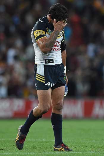 Johnathan Thurston feels the pain after losing a thrilling Queensland derby. Photo: Getty