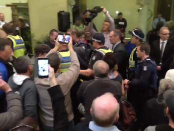 Bendigo Mayor is escorted out by police.