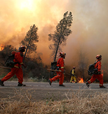 Firefighters conduct a backfire operation to head off the Rocky Fire near Clearlake, California. 
