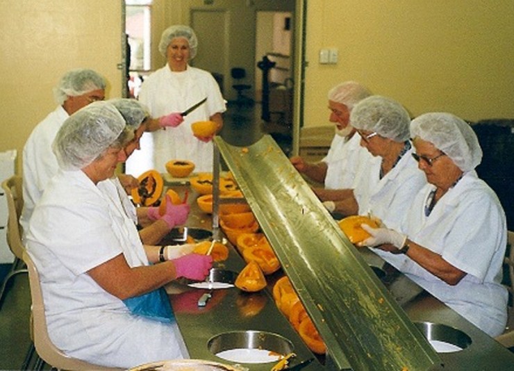 Employees at the factory hard at work peeling papaws.