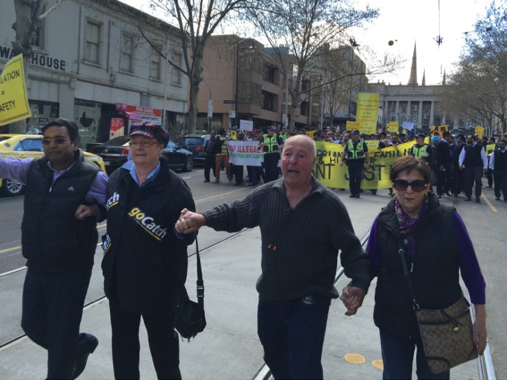 Taxi driver and immigrant to Australia, Leo Mauro (centre), said UberX would send him to his grave.