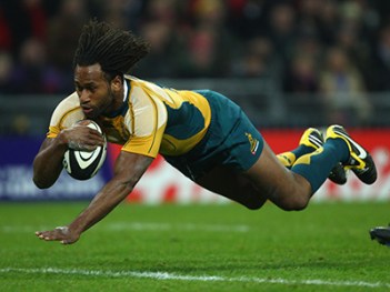 LONDON - DECEMBER 03: Lote Tuqiri of Australia dives over for the first try of the match during the 1908 - 2008 London Olympic Centenary match between The Barbarians and Australia at Wembley Stadium on December 3, 2008 in London, England. (Photo by Mike Hewitt/Getty Images) *** Local Caption *** Lote Tuqiri