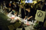 People take part in a candlelight vigil organised by the French cultural institute Alliance Francaise in the Cypriot port city of Limassol on November 15, 2015, in solidarity with the victims of coordinated attacks in Paris. Islamic State jihadists claimed a series of coordinated attacks by gunmen and suicide bombers in Paris that killed at least 129 people in scenes of carnage at a concert hall, restaurants and the national stadium. AFP PHOTO / IAKOVOS HATZISTAVROU (Photo credit should read IAKOVOS HATZISTAVROU/AFP/Getty Images)